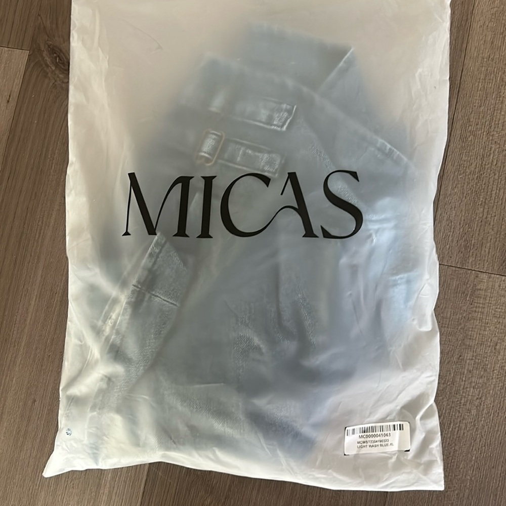 Micas XL light blue wash denim strapless top and pleated  mini skirt set